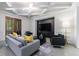 Elegant living room featuring coffered ceilings, comfortable seating, and a modern TV setup at 3117 W Roxboro Ne Rd, Atlanta, GA 30324