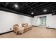 Finished basement with a comfortable seating area and walkout access at 3214 Woodleaf Ct, Marietta, GA 30062