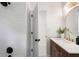 Modern bathroom featuring white subway tiles, open door and a gold faucet at 3214 Woodleaf Ct, Marietta, GA 30062