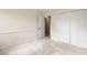Bedroom with carpeted floors, open door, and closets at 3214 Woodleaf Ct, Marietta, GA 30062