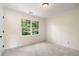 Cozy bedroom with carpet, natural lighting, and white trim at 3214 Woodleaf Ct, Marietta, GA 30062