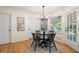 Bright breakfast nook with views and a stylish chandelier for cozy dining at 3214 Woodleaf Ct, Marietta, GA 30062