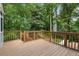Exterior wooden deck overlooking a lush, wooded backyard at 3214 Woodleaf Ct, Marietta, GA 30062