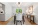 Bright dining room with hardwood floors, white walls, and stylish chandelier at 3214 Woodleaf Ct, Marietta, GA 30062