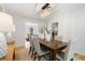 An alternate view of a stunning dining room with modern lighting and bright, neutral decor at 3214 Woodleaf Ct, Marietta, GA 30062
