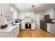 Updated kitchen featuring stainless steel appliances, white cabinets, and bright, natural light at 3214 Woodleaf Ct, Marietta, GA 30062