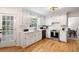 Charming kitchen with white cabinets, stainless steel appliances, and hardwood floors at 3214 Woodleaf Ct, Marietta, GA 30062