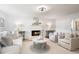 Bright living room with a brick fireplace, plush seating, and neutral decor, offering a cozy and inviting atmosphere at 3214 Woodleaf Ct, Marietta, GA 30062