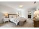 Serene main bedroom with natural light, soft carpet, and en-suite bath at 3214 Woodleaf Ct, Marietta, GA 30062