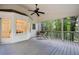 Inviting screened porch with ceiling fan and views to the interior at 3214 Woodleaf Ct, Marietta, GA 30062