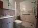 Bathroom features include tiled walls, sink, toilet, and shower at 4048 Emerald Lake Dr, Decatur, GA 30035