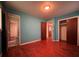 Bedroom with hardwood floors, blue walls, and closet space at 4048 Emerald Lake Dr, Decatur, GA 30035