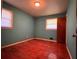 Simple bedroom with hardwood floors, blue walls, and natural light from two windows at 4048 Emerald Lake Dr, Decatur, GA 30035