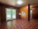 An eat-in kitchen with hardwood floors, wood-paneled walls and double doors leading to the backyard at 4048 Emerald Lake Dr, Decatur, GA 30035