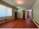 Cozy living room featuring hardwood floors, neutral green walls and a large window at 4048 Emerald Lake Dr, Decatur, GA 30035