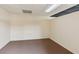 Neutral basement space with carpeted floors and a drop ceiling, awaiting customization at 610 Golden Meadows Ln, Suwanee, GA 30024