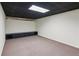 Basement offers potential with carpeted floors and a long built-in storage unit at 610 Golden Meadows Ln, Suwanee, GA 30024