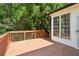 Spacious outdoor deck overlooking a lush, wooded backyard at 610 Golden Meadows Ln, Suwanee, GA 30024