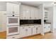 Well-appointed kitchen featuring double ovens, granite countertops, and custom cabinetry at 610 Golden Meadows Ln, Suwanee, GA 30024