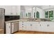 Modern kitchen with white cabinets, granite countertops, and stainless steel appliances at 610 Golden Meadows Ln, Suwanee, GA 30024