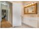 Bathroom featuring a hallway view, large mirror, marble counter top, and vanity at 1640 Settindown Dr, Roswell, GA 30075