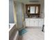 Bathroom featuring a shower, soaking tub, and vanity with a framed mirror at 1640 Settindown Dr, Roswell, GA 30075