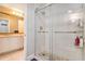Bathroom with a glass-enclosed shower stall, pebble floor, and marble counter top at 1640 Settindown Dr, Roswell, GA 30075