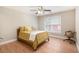 Bedroom with one window, fan, hardwood floors, and a comfy looking bed at 1640 Settindown Dr, Roswell, GA 30075