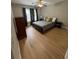 Comfortable bedroom with hardwood floors, large windows and a gray comforter, a perfect space for relaxation at 1640 Settindown Dr, Roswell, GA 30075