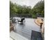 Relaxing outdoor deck area perfect for entertaining, featuring comfortable seating and a serene view of the surrounding greenery at 1640 Settindown Dr, Roswell, GA 30075