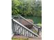 Deck with a beautiful view of the lake is perfect for relaxing and enjoying the natural surroundings at 1640 Settindown Dr, Roswell, GA 30075