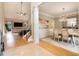 Elegant dining room with modern chandelier, hardwood floors, and easy access to living room at 1640 Settindown Dr, Roswell, GA 30075