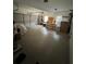 Spacious garage offering ample parking and storage space, with a workbench and overhead lighting at 1640 Settindown Dr, Roswell, GA 30075