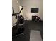 A home gym equipped with a Max Trainer and other exercise equipment, perfect for staying active at home at 1640 Settindown Dr, Roswell, GA 30075