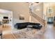 Bright living room with high ceilings, staircase, hardwood floors, and modern decor and fireplace in background at 1640 Settindown Dr, Roswell, GA 30075