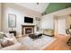 Inviting living area featuring a fireplace, high ceilings, and an open layout perfect for entertaining guests at 1640 Settindown Dr, Roswell, GA 30075