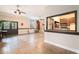 Spacious living room featuring tile floors, a fireplace, and an adjacent kitchen through an open window at 1640 Settindown Dr, Roswell, GA 30075