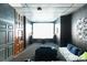 Basement theater room features a large screen, dark walls, and comfortable seating for entertainment at 1640 Settindown Dr, Roswell, GA 30075
