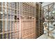 Custom wine cellar featuring wooden racks, ample storage, and climate control for wine enthusiasts at 1640 Settindown Dr, Roswell, GA 30075