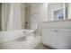 Bathroom featuring a shower-tub combo, a toilet and white vanity at 2464 Georgetown Ave, Atlanta, GA 30345
