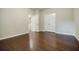 Spacious bedroom with hardwood floors, a double door closet, and plenty of natural light at 2464 Georgetown Ave, Atlanta, GA 30345