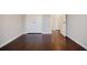 Spacious bedroom with hardwood floors, closet and a doorway to an ensuite bathroom at 2464 Georgetown Ave, Atlanta, GA 30345