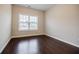 Bright bedroom with hardwood floors and a large window offering natural light at 2464 Georgetown Ave, Atlanta, GA 30345