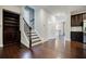 Entryway with staircase, built-in bookcase and hardwood flooring at 2464 Georgetown Ave, Atlanta, GA 30345
