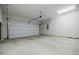 Clean two car garage with painted walls and high ceilings, awaiting your personal touch and vehicles at 2464 Georgetown Ave, Atlanta, GA 30345