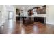 A spacious kitchen features dark wood cabinets, stainless appliances, and granite countertops at 2464 Georgetown Ave, Atlanta, GA 30345
