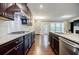 Modern kitchen with granite countertops, stainless steel appliances, and hardwood flooring at 2464 Georgetown Ave, Atlanta, GA 30345