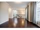 Spacious living room with hardwood floors, crown molding, and large windows offering ample light at 2464 Georgetown Ave, Atlanta, GA 30345