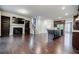 A large living room features a fireplace with built-in shelves and dark hardwood flooring at 2464 Georgetown Ave, Atlanta, GA 30345