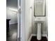Elegant powder room with pedestal sink, modern fixtures, and stylish mirror at 2464 Georgetown Ave, Atlanta, GA 30345